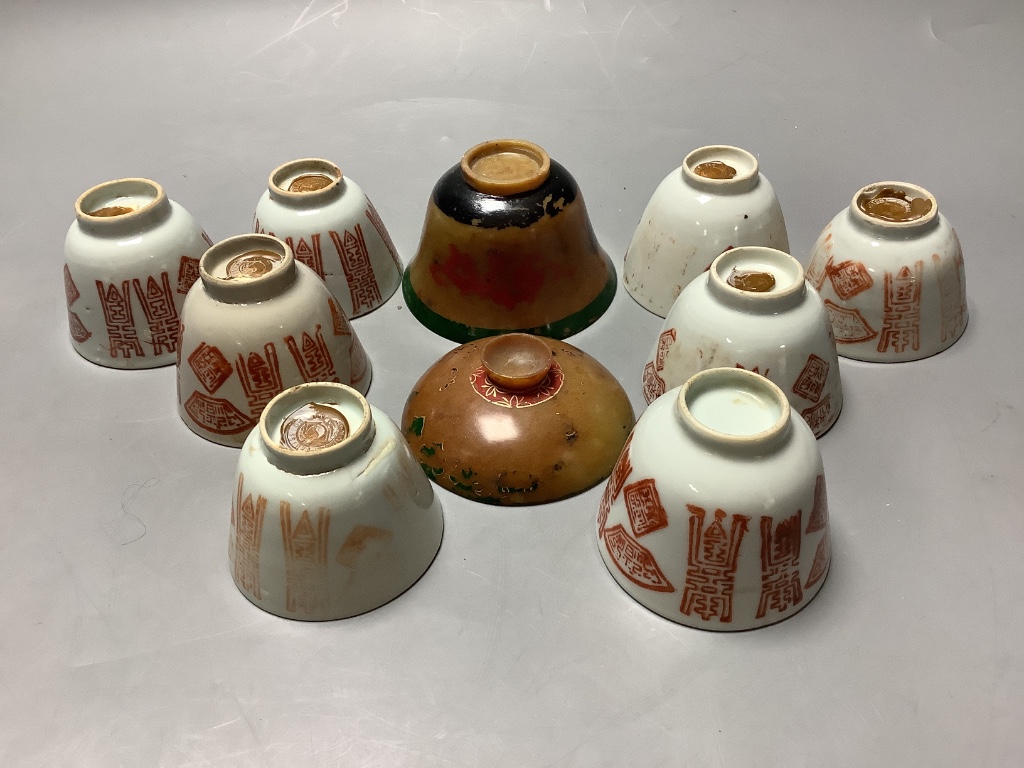 A 19th century Chinese painted soapstone rice bowl and cover and a group of red enamelled porcelain cups